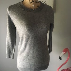 Woman’s silver glitter sweater